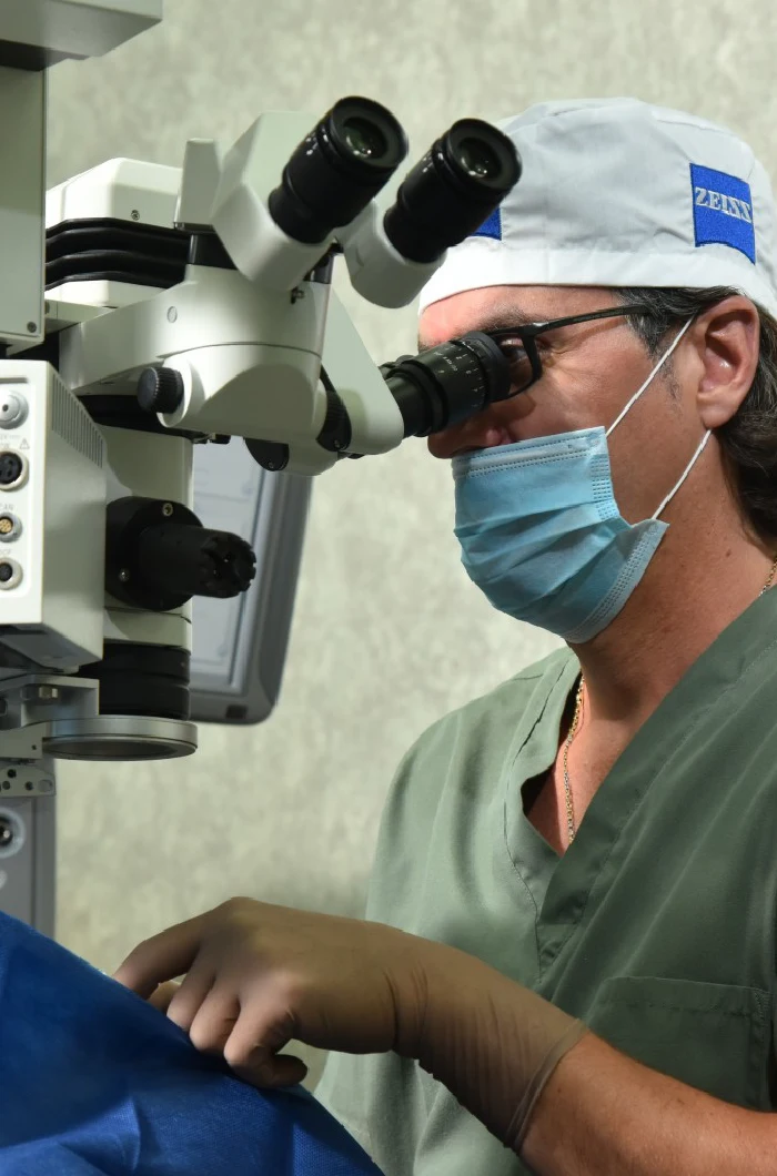 Doctor using microscope